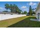 A spacious backyard includes a white fence, green grass, and ample space at 1620 Haddock St, St Cloud, FL 34771