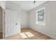 An empty bedroom featuring wood-style floors and a bright window at 1620 Haddock St, St Cloud, FL 34771