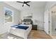 Bright bedroom with hardwood floors, ample natural light, and ensuite bathroom at 1620 Haddock St, St Cloud, FL 34771