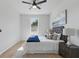 Bright bedroom featuring a ceiling fan, neutral color palette and a cozy queen-sized bed at 1620 Haddock St, St Cloud, FL 34771