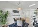 Cozy dining area featuring a round table, modern lighting, and adjacent living spaces at 1620 Haddock St, St Cloud, FL 34771