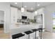 Modern kitchen featuring white cabinetry, stainless steel appliances and breakfast bar seating at 1620 Haddock St, St Cloud, FL 34771