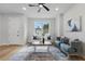 Bright living room with comfortable seating, stylish decor, and a large window for natural light at 1620 Haddock St, St Cloud, FL 34771