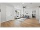 Well-lit living room with a comfortable sofa, accent chairs, and an open doorway at 1620 Haddock St, St Cloud, FL 34771