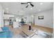 Open living area showcasing a modern kitchen, dining space, and a comfortable seating area at 1620 Haddock St, St Cloud, FL 34771