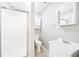 Clean bathroom featuring a shower, toilet, sink, and white cabinetry with neutral walls at 1631 Oak Hill Trl, Kissimmee, FL 34747