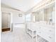 Bathroom features dual sinks, soaking tub, and modern fixtures at 1631 Oak Hill Trl, Kissimmee, FL 34747