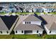 New construction home boasts a manicured lawn in a vibrant neighborhood at 19065 Blueleaf St, Orlando, FL 32827