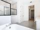 A spacious bathroom offers a soaking tub, a glass shower, and dual vanities at 19065 Blueleaf St, Orlando, FL 32827