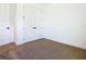 This bright bedroom features neutral carpet, white trim, and a double door closet for ample storage at 19065 Blueleaf St, Orlando, FL 32827