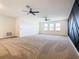 Large bonus room with three windows and a modern design accent wall at 19065 Blueleaf St, Orlando, FL 32827