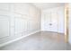 Bright, versatile room with tile flooring, a window view, and classic wall detailing at 19065 Blueleaf St, Orlando, FL 32827