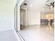 View from patio into spacious living area with sleek floors and modern finishes at 19065 Blueleaf St, Orlando, FL 32827