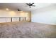 A spacious upstairs living room with carpet, recessed lighting, and a modern railing at 19065 Blueleaf St, Orlando, FL 32827