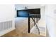 Upstairs living room featuring stylish black accent wall, modern railing, and plush carpeting at 19065 Blueleaf St, Orlando, FL 32827