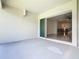 Covered patio features a sliding glass door leading to the interior of the home at 19065 Blueleaf St, Orlando, FL 32827