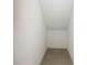 Small, enclosed storage space with neutral tile and white walls at 19065 Blueleaf St, Orlando, FL 32827
