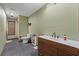 Modern bathroom with gray tile, floating vanity, and updated fixtures at 2114 Bluff Oak St, Apopka, FL 32712
