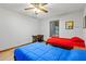 Bedroom with wood-look flooring, ceiling fan, natural light, desk, and two twin beds at 2114 Bluff Oak St, Apopka, FL 32712