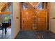 Entryway with tiled floor, wooden doors, and mirrored wall at 2114 Bluff Oak St, Apopka, FL 32712