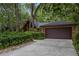 Beautiful home with a large two-car garage and brick exterior, surrounded by trees at 2114 Bluff Oak St, Apopka, FL 32712