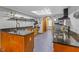 Kitchen featuring wood cabinets, granite countertops, and stainless steel appliances at 2114 Bluff Oak St, Apopka, FL 32712