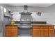 Kitchen featuring a stainless steel range and wood cabinets at 2114 Bluff Oak St, Apopka, FL 32712