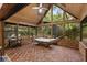 Bright, screened patio with a hammock and high ceilings, perfect for relaxing and enjoying nature views at 2114 Bluff Oak St, Apopka, FL 32712