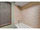 Shower with neutral-toned tiles and a handheld shower fixture at 2114 Bluff Oak St, Apopka, FL 32712