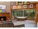 The sunroom includes brick floors, windows overlooking the trees, and a hammock at 2114 Bluff Oak St, Apopka, FL 32712
