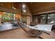Stylish sunroom with high ceilings, a hammock, and access to the main living areas at 2114 Bluff Oak St, Apopka, FL 32712