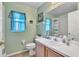 Bright bathroom features a single sink vanity, toilet, and shower-tub combination at 2122 Korat Ln, Maitland, FL 32751