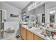 Bright bathroom with double sinks, tiled floors, and shower at 2122 Korat Ln, Maitland, FL 32751