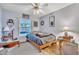 Cozy bedroom with ceiling fan, gray walls, and hot tub view from the window at 2122 Korat Ln, Maitland, FL 32751