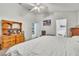 Spacious bedroom features ceiling fan and access to bathroom and kitchen at 2122 Korat Ln, Maitland, FL 32751