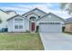 Charming single-Gathering home with a well-maintained lawn and a two-car garage on a sunny day at 2122 Korat Ln, Maitland, FL 32751