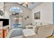 Cozy living room with sliding glass doors, fan, and view of the backyard at 2122 Korat Ln, Maitland, FL 32751