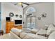 Bright living room with a fan, and sliding glass doors to the backyard at 2122 Korat Ln, Maitland, FL 32751