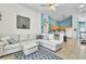 Open-concept living room and kitchen with modern appliances and tiled floor at 2122 Korat Ln, Maitland, FL 32751