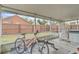 View of the enclosed patio with a bicycle and work-out bench at 2122 Korat Ln, Maitland, FL 32751