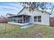 Photo showcasing the screened-in back porch with a beautiful lawn and ample space at 2122 Korat Ln, Maitland, FL 32751