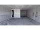 Unfinished basement space with concrete floors and drywall ready for customization at 22117 Amberbush Court, Mount Dora, FL 32757