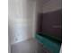 This bathroom has a green shower or tub, drywall and concrete floors at 22117 Amberbush Court, Mount Dora, FL 32757