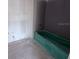 Bathroom showcasing a retro bathtub at 22117 Amberbush Court, Mount Dora, FL 32757