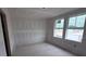 Bright bedroom with ample natural light from two large windows at 22117 Amberbush Court, Mount Dora, FL 32757