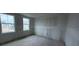 Bedroom with large windows showing neighborhood views at 22117 Amberbush Court, Mount Dora, FL 32757