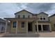 Charming two-story home featuring a welcoming covered porch and attached two-car garage at 22117 Amberbush Court, Mount Dora, FL 32757