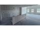 Spacious living room with rough-in for a kitchen and bright natural light at 22117 Amberbush Court, Mount Dora, FL 32757