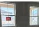 Bright double windows showcasing natural light and neighborhood views at 22117 Amberbush Court, Mount Dora, FL 32757