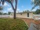 Backyard of home featuring an oak tree, grass, and fenced-in yard at 224 Briar Cliff Dr, Longwood, FL 32779